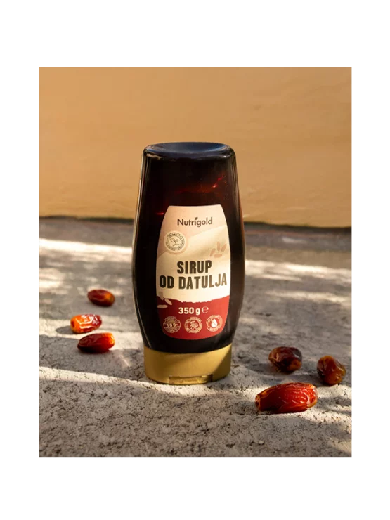 Nutrigold sirup od datulja u prozirnoj, plastičnoj ambalaži od 350g.