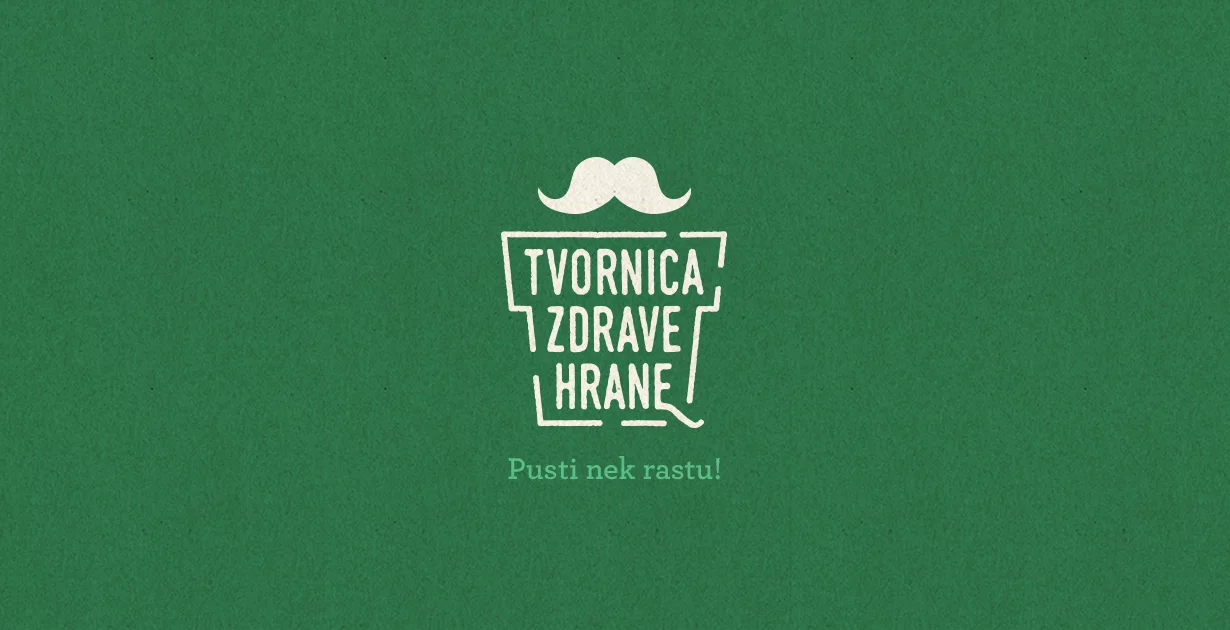 Stilizirani logo Tvornice Zdrave Hrane s brkovima na zelenoj pozadini