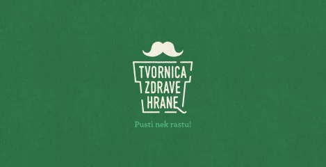 Stilizirani logo Tvornice Zdrave Hrane s brkovima na zelenoj pozadini